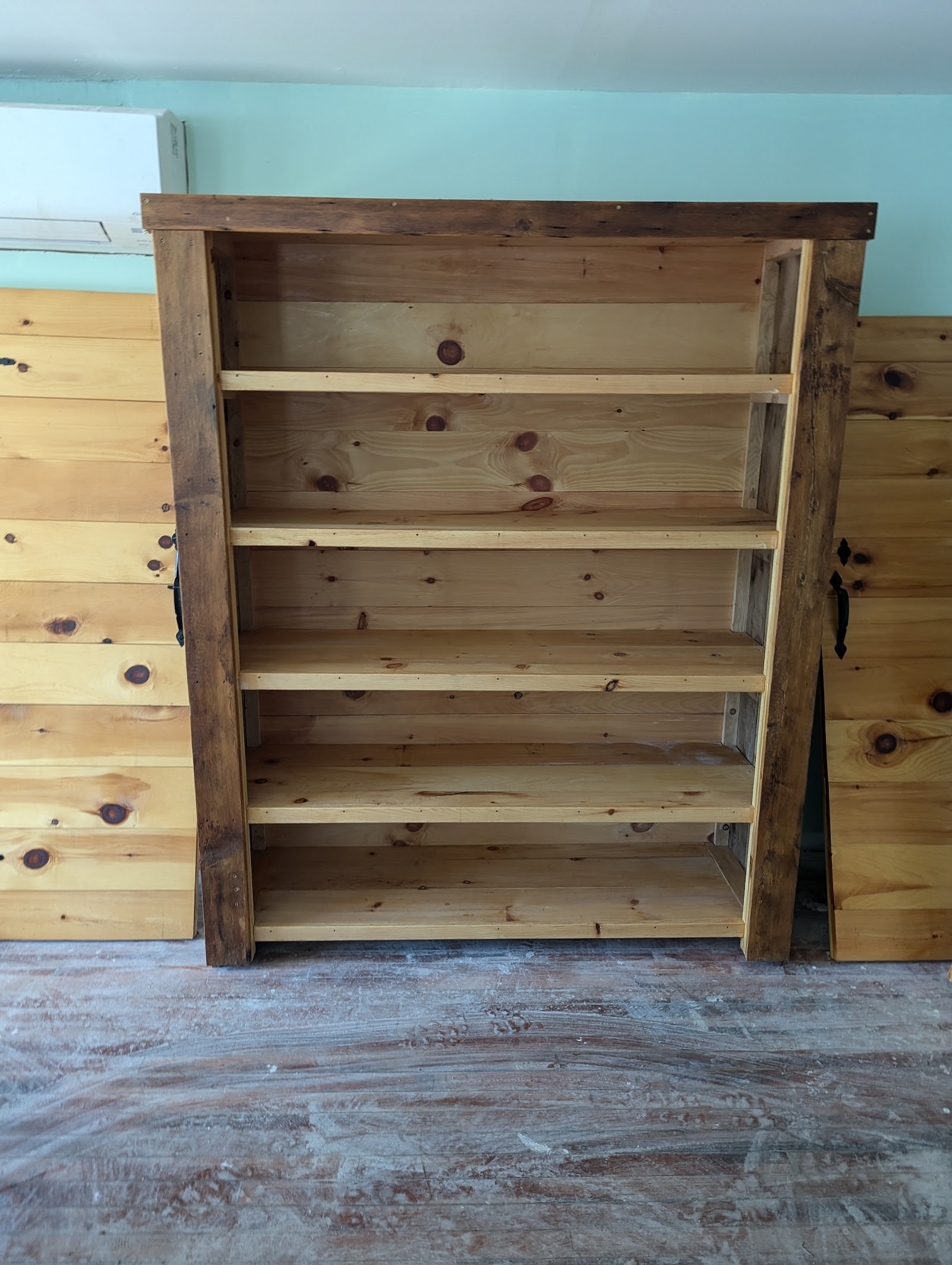 Custom shelving unit with mixed pine and reclaimed wood