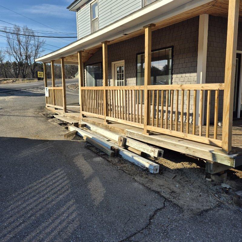 Porch deck with wood railing and posts