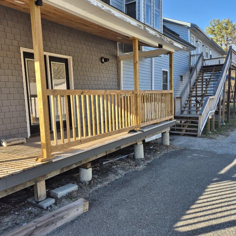 New deck build with wood railings, posts, and steps